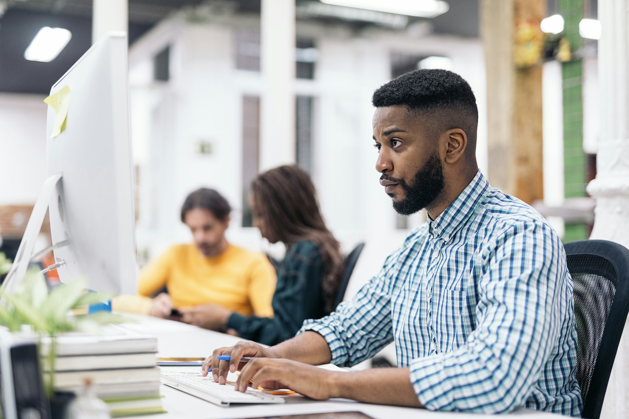 African Office Worker Using Computer