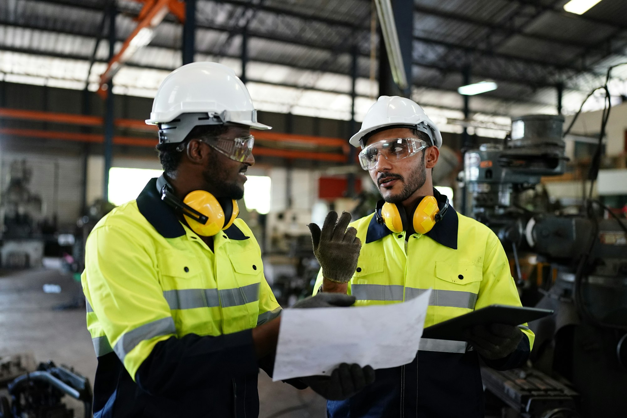 industrial factory worker working in metal manufacturing industry